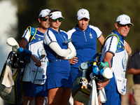 GAINESVILLE, VIRGINIA - SEPTEMBER 14: Carlota Ciganda of Team Europe  and Emily Kristine Pedersen of Team Europe look with their caddies dow...