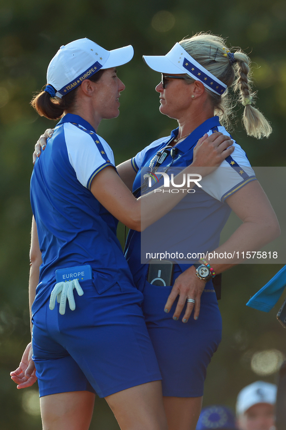 GAINESVILLE, VIRGINIA - SEPTEMBER 14: Carlota Ciganda of Team Europe celebrates with Emily Kristine Pedersen of Team Europe on the 17th gree...