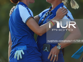 GAINESVILLE, VIRGINIA - SEPTEMBER 14: Carlota Ciganda of Team Europe celebrates with Emily Kristine Pedersen of Team Europe on the 17th gree...