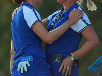 GAINESVILLE, VIRGINIA - SEPTEMBER 14: Carlota Ciganda of Team Europe celebrates with Emily Kristine Pedersen of Team Europe on the 17th gree...