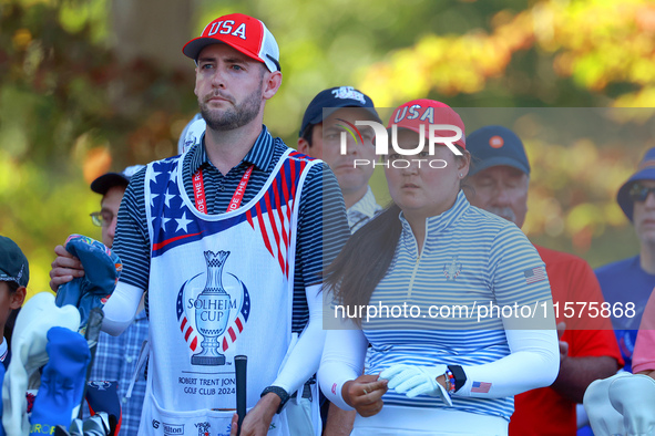 GAINESVILLE, VIRGINIA - SEPTEMBER 14: Allisen Corpuz of the United States looks with her caddie from the 15th tee during Day Two of the Solh...