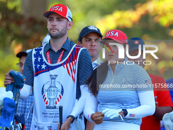 GAINESVILLE, VIRGINIA - SEPTEMBER 14: Allisen Corpuz of the United States looks with her caddie from the 15th tee during Day Two of the Solh...