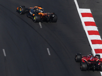 Oscar Piastri of McLaren and Charles Leclerc of Ferrari during the Formula 1 Grand Prix of Azerbaijan at Baku City Circuit in Baku, Azerbaij...