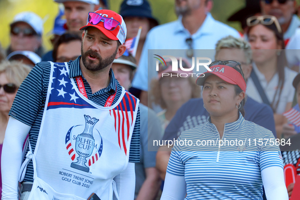 GAINESVILLE, VIRGINIA - SEPTEMBER 14: Lilia Vu of Team USA looks with her caddie from the 15th tee during Day Two of the Solheim Cup at Robe...