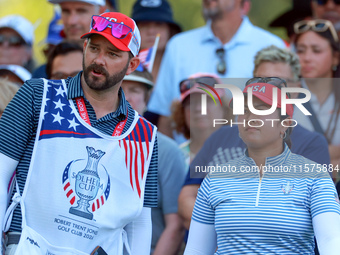 GAINESVILLE, VIRGINIA - SEPTEMBER 14: Lilia Vu of Team USA looks with her caddie from the 15th tee during Day Two of the Solheim Cup at Robe...