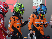 Charles Leclerc of Ferrari, Lando Norris and Oscar Piastri of McLaren after the Formula 1 Grand Prix of Azerbaijan at Baku City Circuit in B...