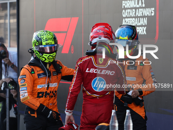 Lando Norris of McLaren, Charles Leclerc of Ferrari and Oscar Piastri of McLaren after the Formula 1 Grand Prix of Azerbaijan at Baku City C...