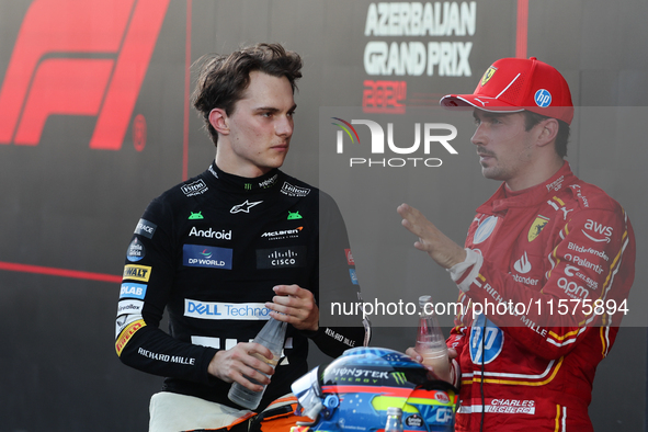 Oscar Piastri of McLaren and Charles Leclerc of Ferrari after the Formula 1 Grand Prix of Azerbaijan at Baku City Circuit in Baku, Azerbaija...