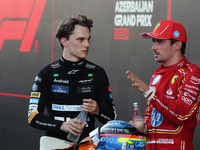 Oscar Piastri of McLaren and Charles Leclerc of Ferrari after the Formula 1 Grand Prix of Azerbaijan at Baku City Circuit in Baku, Azerbaija...