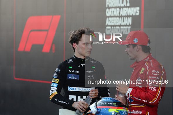 Oscar Piastri of McLaren and Charles Leclerc of Ferrari after the Formula 1 Grand Prix of Azerbaijan at Baku City Circuit in Baku, Azerbaija...