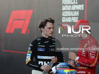 Oscar Piastri of McLaren and Charles Leclerc of Ferrari after the Formula 1 Grand Prix of Azerbaijan at Baku City Circuit in Baku, Azerbaija...