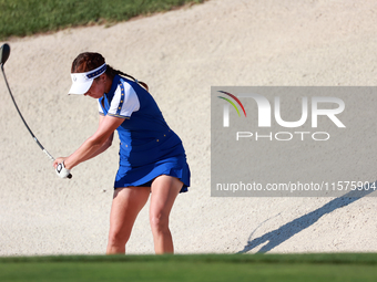 GAINESVILLE, VIRGINIA - SEPTEMBER 14: Georgia Hall of Team Europe hits from the bunker on the 15th fairway during Day Two of the Solheim Cup...