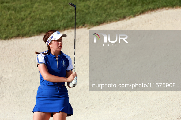 GAINESVILLE, VIRGINIA - SEPTEMBER 14: Georgia Hall of Team Europe hits from the bunker on the 15th fairway during Day Two of the Solheim Cup...