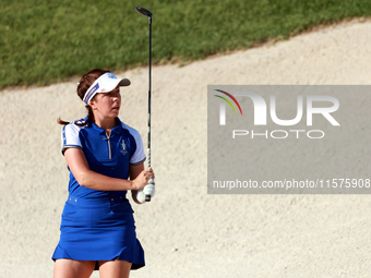 GAINESVILLE, VIRGINIA - SEPTEMBER 14: Georgia Hall of Team Europe hits from the bunker on the 15th fairway during Day Two of the Solheim Cup...