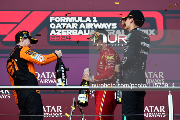 Oscar Piastri of McLaren, Charles Leclerc of Ferrari and George Russell of Mercedes after the Formula 1 Grand Prix of Azerbaijan at Baku Cit...