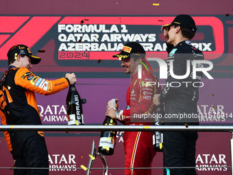 Oscar Piastri of McLaren, Charles Leclerc of Ferrari and George Russell of Mercedes after the Formula 1 Grand Prix of Azerbaijan at Baku Cit...