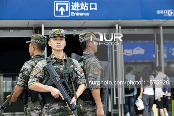 Armed police officers and soldiers are on duty at a station during the Mid-Autumn Festival in Baise, China, on September 15, 2024. 