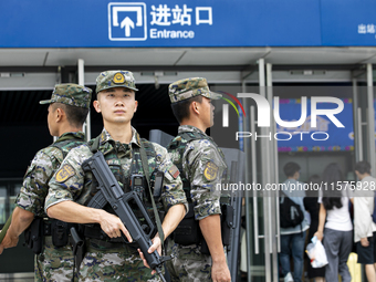 Armed police officers and soldiers are on duty at a station during the Mid-Autumn Festival in Baise, China, on September 15, 2024. (