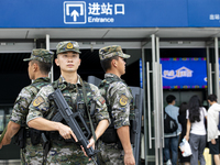 Armed police officers and soldiers are on duty at a station during the Mid-Autumn Festival in Baise, China, on September 15, 2024. (