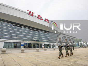 Armed police officers patrol a station during the Mid-Autumn Festival in Baise, China, on September 15, 2024. (