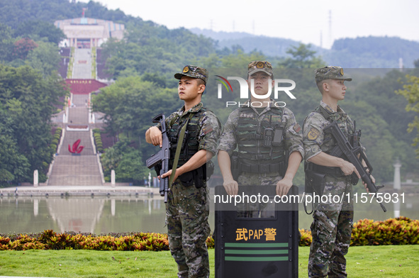 Armed police officers are on duty at a scenic spot during the Mid-Autumn Festival in Baise, China, on September 15, 2024. 