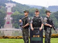 Armed police officers are on duty at a scenic spot during the Mid-Autumn Festival in Baise, China, on September 15, 2024. (