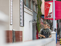 Armed police officers patrol during the Mid-Autumn Festival in Baise, China, on September 15, 2024. (