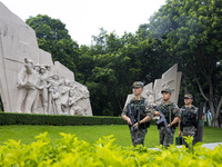 Armed police officers patrol a scenic spot during the Mid-Autumn Festival in Baise, China, on September 15, 2024. (