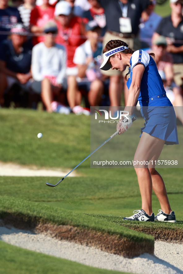 GAINESVILLE, VIRGINIA - SEPTEMBER 14: Georgia Hall of Team Europe hits to the 14th green during Day Two of the Solheim Cup at Robert Trent J...