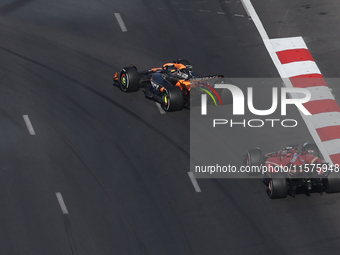 Oscar Piastri of McLaren and Charles Leclerc of Ferrari during the Formula 1 Grand Prix of Azerbaijan at Baku City Circuit in Baku, Azerbaij...