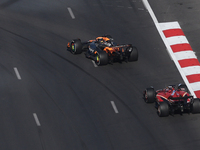 Oscar Piastri of McLaren and Charles Leclerc of Ferrari during the Formula 1 Grand Prix of Azerbaijan at Baku City Circuit in Baku, Azerbaij...