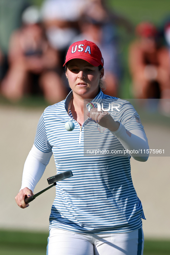 GAINESVILLE, VIRGINIA - SEPTEMBER 14: Ally Ewing of the United States tosses up her ball at the 14th green during Day Two of the Solheim Cup...