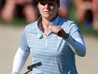 GAINESVILLE, VIRGINIA - SEPTEMBER 14: Ally Ewing of the United States tosses up her ball at the 14th green during Day Two of the Solheim Cup...