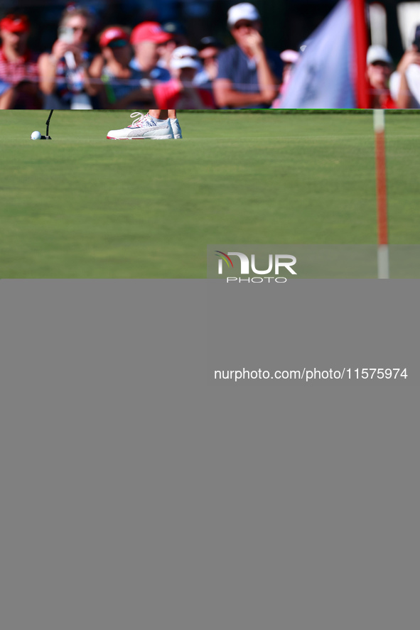 GAINESVILLE, VIRGINIA - SEPTEMBER 14: Lexi Thompson of the United States putts on the 14th green during Day Two of the Solheim Cup at Robert...