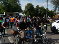 A hundred people take part in a bike demonstration to mark the second anniversary of Mahsa Amini's death for the Woman, Life, and Freedom mo...