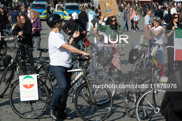 A hundred people take part in a bike demonstration to mark the second anniversary of Mahsa Amini's death for the Woman, Life, and Freedom mo...