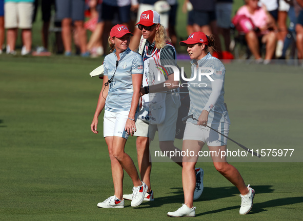 GAINESVILLE, VIRGINIA - SEPTEMBER 14: Ally Ewing of the United States walks with Captain Stacy Lewis of the United States to the 14th green...