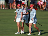 GAINESVILLE, VIRGINIA - SEPTEMBER 14: Ally Ewing of the United States walks with Captain Stacy Lewis of the United States to the 14th green...