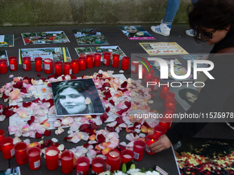 A memorial site with candle lights is set as a hundred people take part in a bike demonstration to mark the second anniversary of Mahsa Amin...