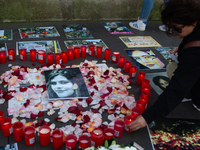 A memorial site with candle lights is set as a hundred people take part in a bike demonstration to mark the second anniversary of Mahsa Amin...