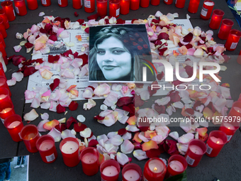 A memorial site with candle lights is set as a hundred people take part in a bike demonstration to mark the second anniversary of Mahsa Amin...