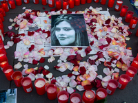 A memorial site with candle lights is set as a hundred people take part in a bike demonstration to mark the second anniversary of Mahsa Amin...