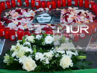 A memorial site with candle lights is set as a hundred people take part in a bike demonstration to mark the second anniversary of Mahsa Amin...