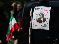 A hundred people take part in a bike demonstration to mark the second anniversary of Mahsa Amini's death for the Woman, Life, and Freedom mo...