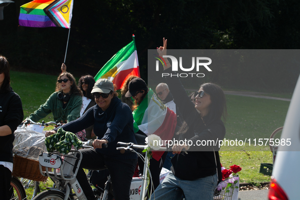 A hundred people take part in a bike demonstration to mark the second anniversary of Mahsa Amini's death for the Woman, Life, and Freedom mo...