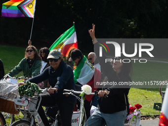 A hundred people take part in a bike demonstration to mark the second anniversary of Mahsa Amini's death for the Woman, Life, and Freedom mo...