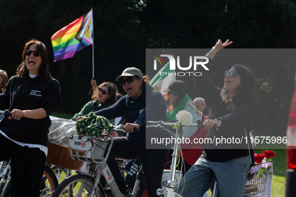 A hundred people take part in a bike demonstration to mark the second anniversary of Mahsa Amini's death for the Woman, Life, and Freedom mo...