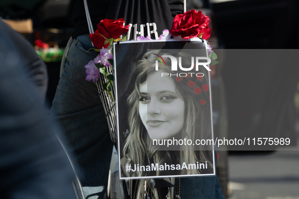 A hundred people take part in a bike demonstration to mark the second anniversary of Mahsa Amini's death for the Woman, Life, and Freedom mo...