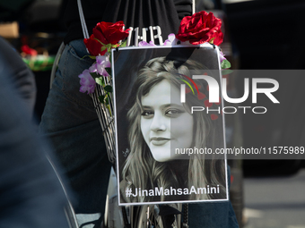 A hundred people take part in a bike demonstration to mark the second anniversary of Mahsa Amini's death for the Woman, Life, and Freedom mo...