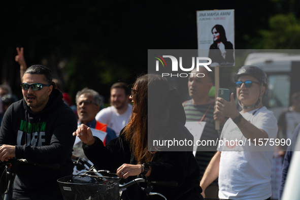 A hundred people take part in a bike demonstration to mark the second anniversary of Mahsa Amini's death for the Woman, Life, and Freedom mo...